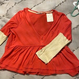 Free people long sleeve tee, hits at waist.